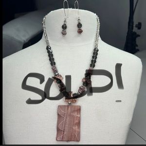 A beautiful mauve and grey necklace set by Visions of Beauty and Beyond